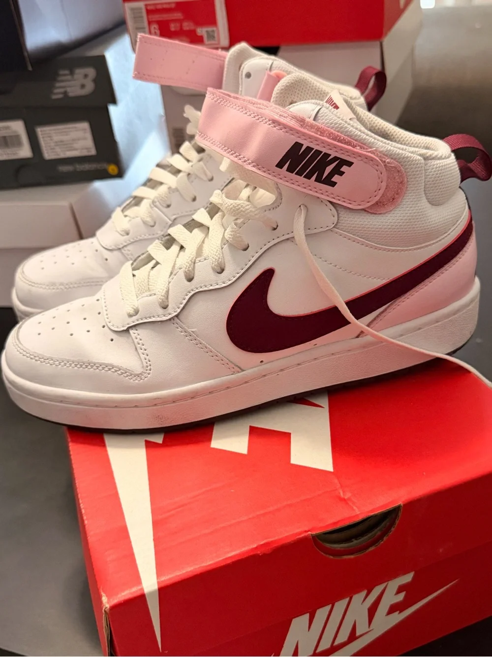 Nike White High-Top Sneakers with Pink Strap and Maroon Swoosh